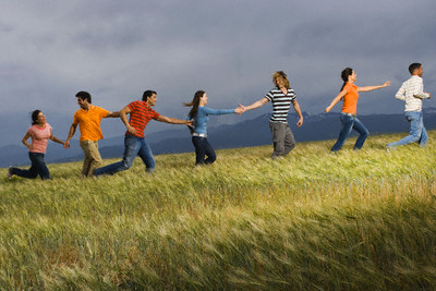 Young People Walking in Meadow